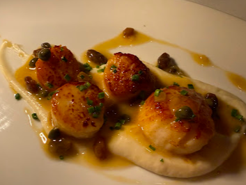 C&O Restaurant signature dishes Slow Braised Retreat Farm Lamb in Crisp Pastry
Maryland Jumbo Lump Crab Cake
Wood Grilled Prime New York Strip